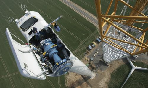 Birds eye view of works on top of a wind turbine. 