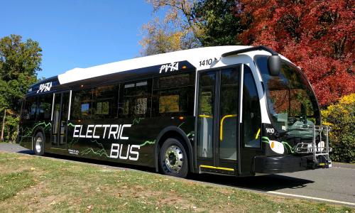 Electric bus in New England on fall day
