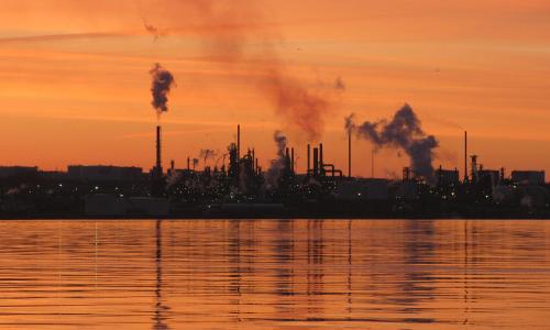 An oil refinery at dawn