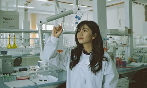 Scientist in white lab coat in a lab