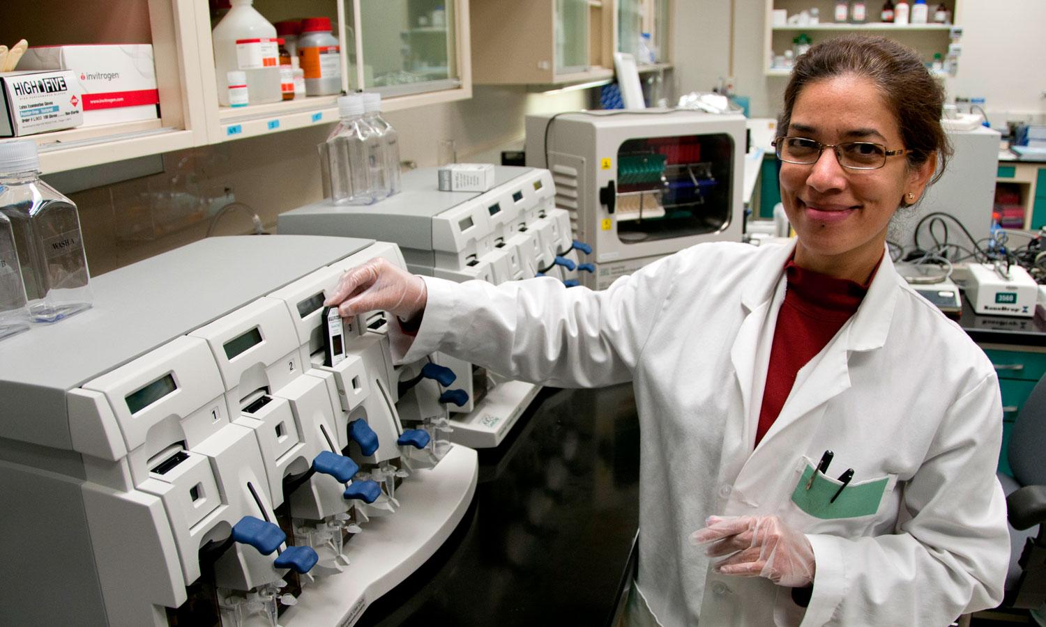 National Center for Toxicological Research scientist processing a microarray to measure and assess the level of genes found in a tissue sample