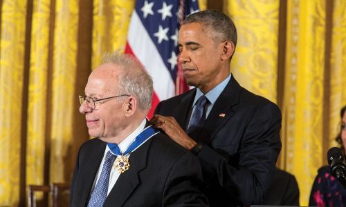 President Obama awarding a medal to a member of the UCS board